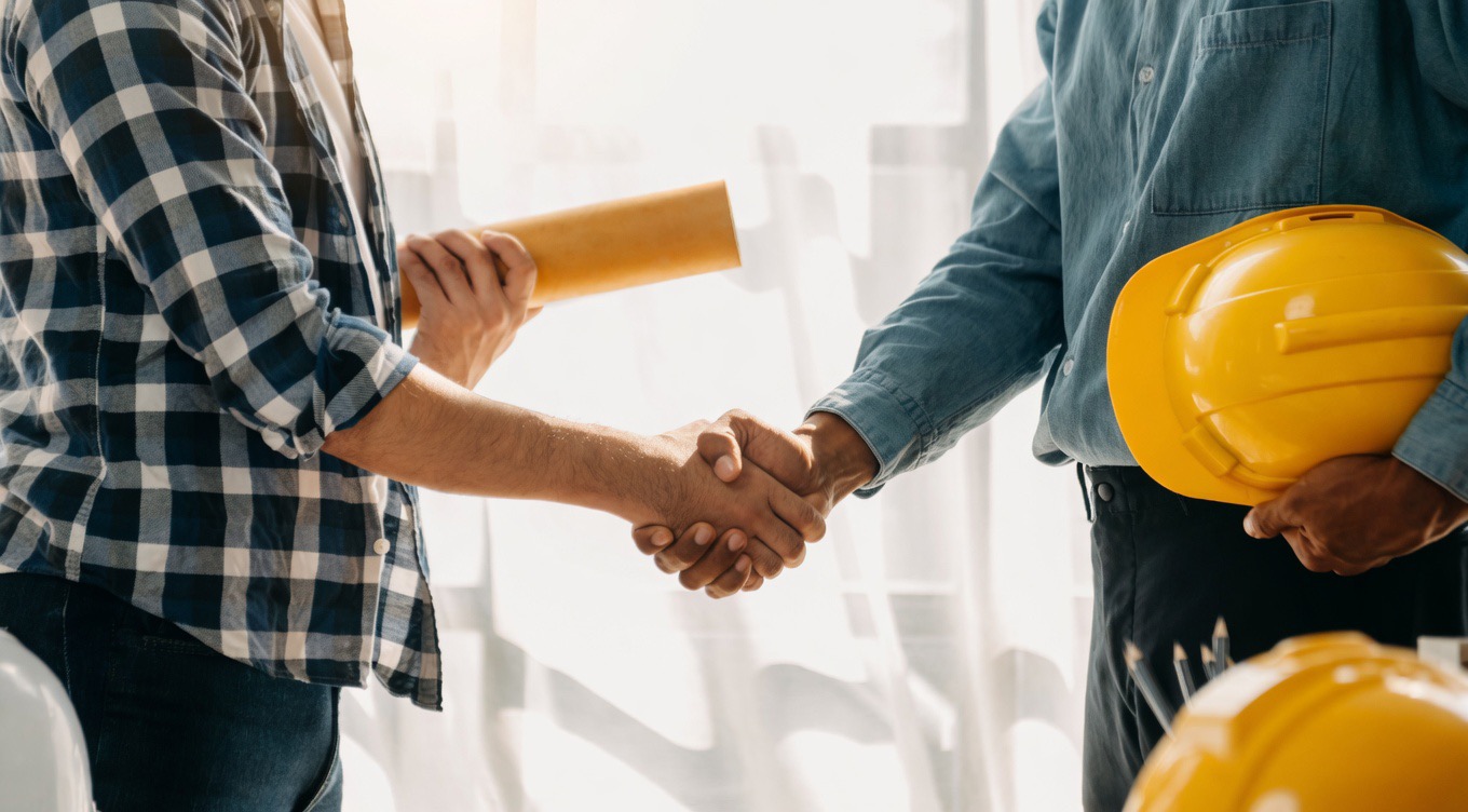 Construction partner reviewing project work